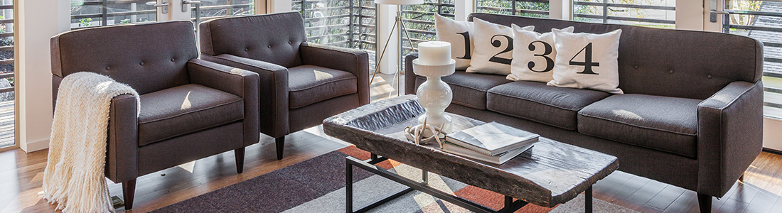 a living room with furniture and decor