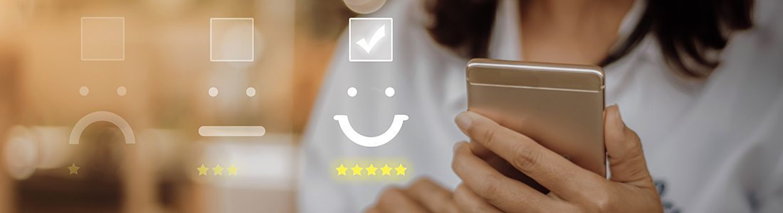 A woman with a smartphone on her hand and a illustration of a smile and five star showing she is satisfied