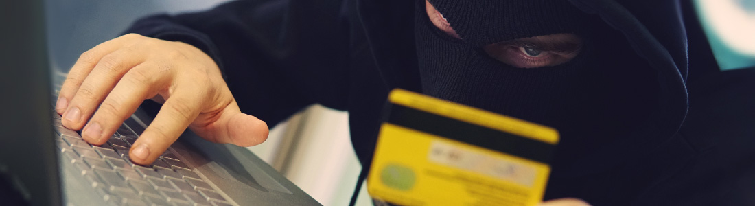 person using credit card on a computer